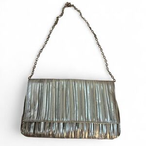 Metallic silver pleated clutch bag with chain strap.